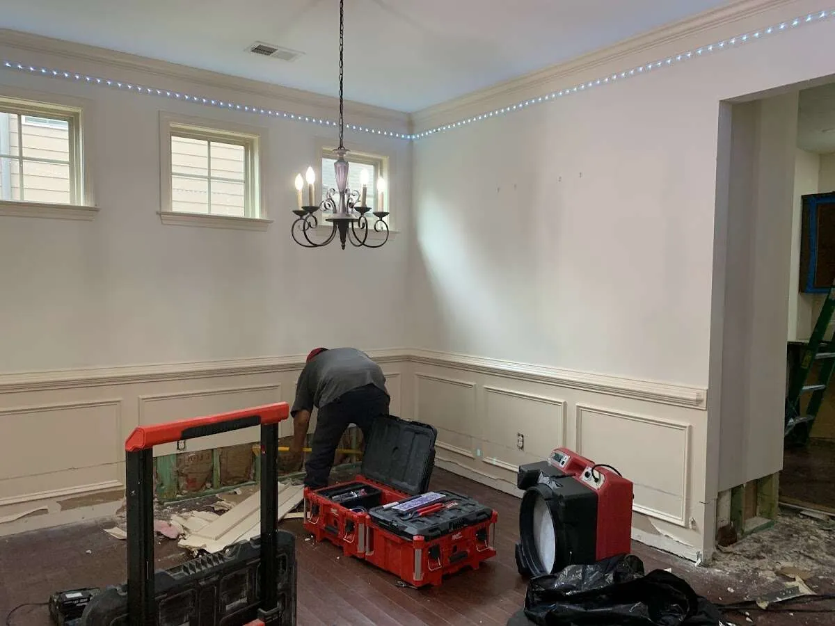 Restoration technician with professional equipment in Corcoran